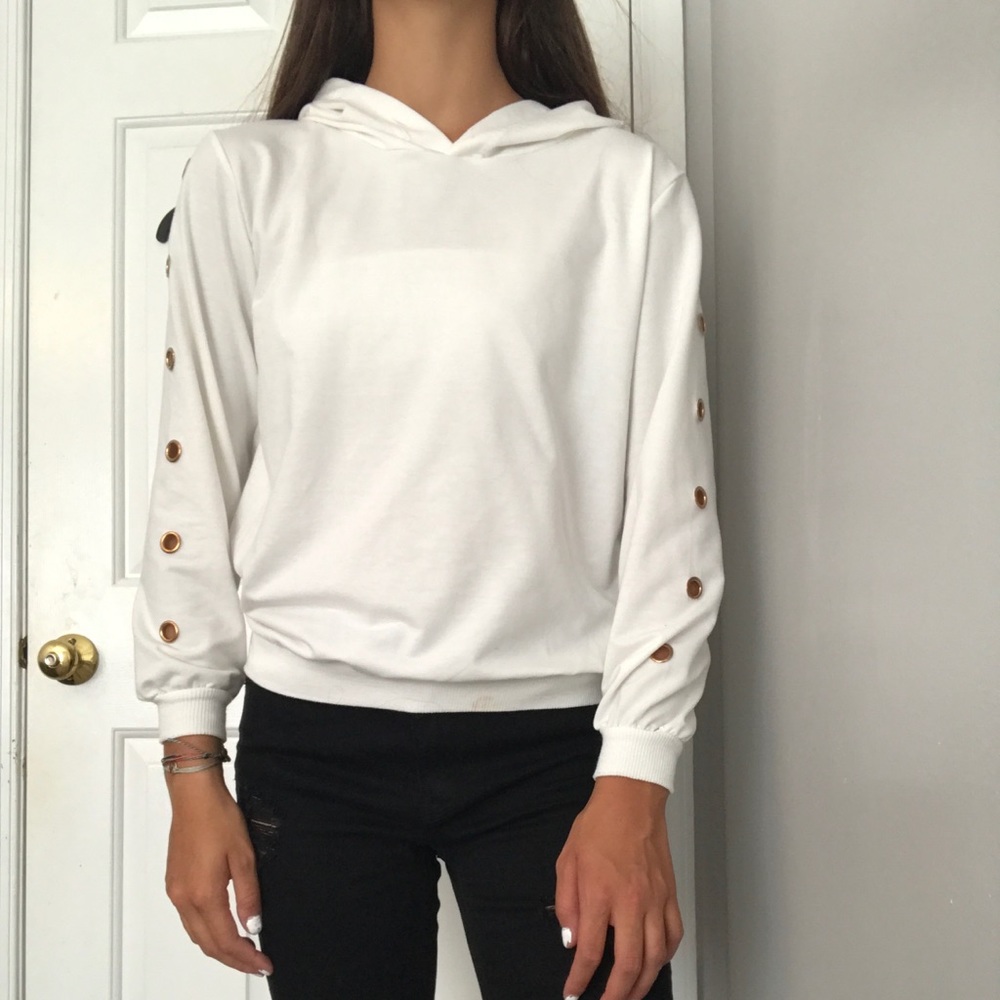 White sweatshirt with gold holes